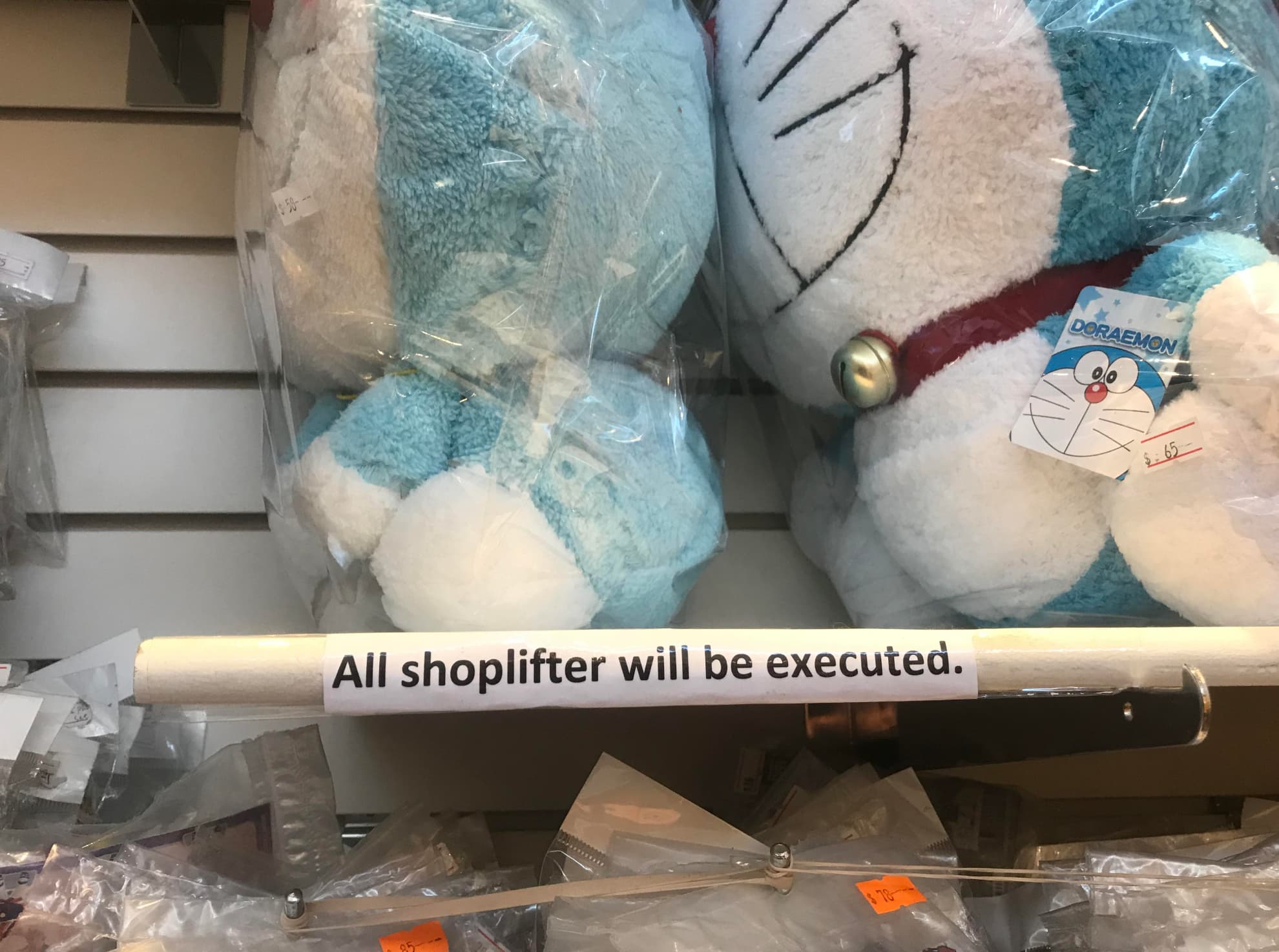 stuffed toy - $50 Doraemon $.65 All shoplifter will be executed.